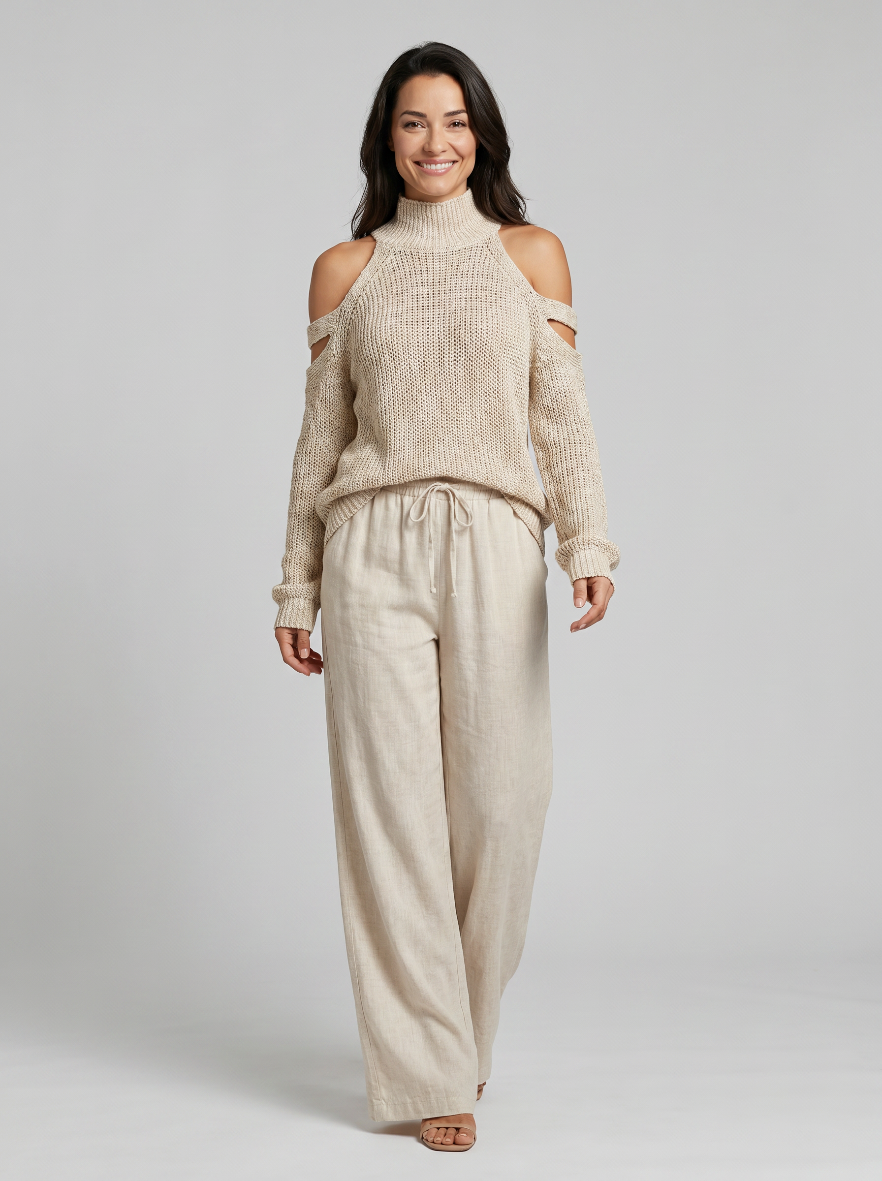 Conjunto de top de cuello tortuga en punto beige con hombros al descubierto y pantalones de pierna ancha